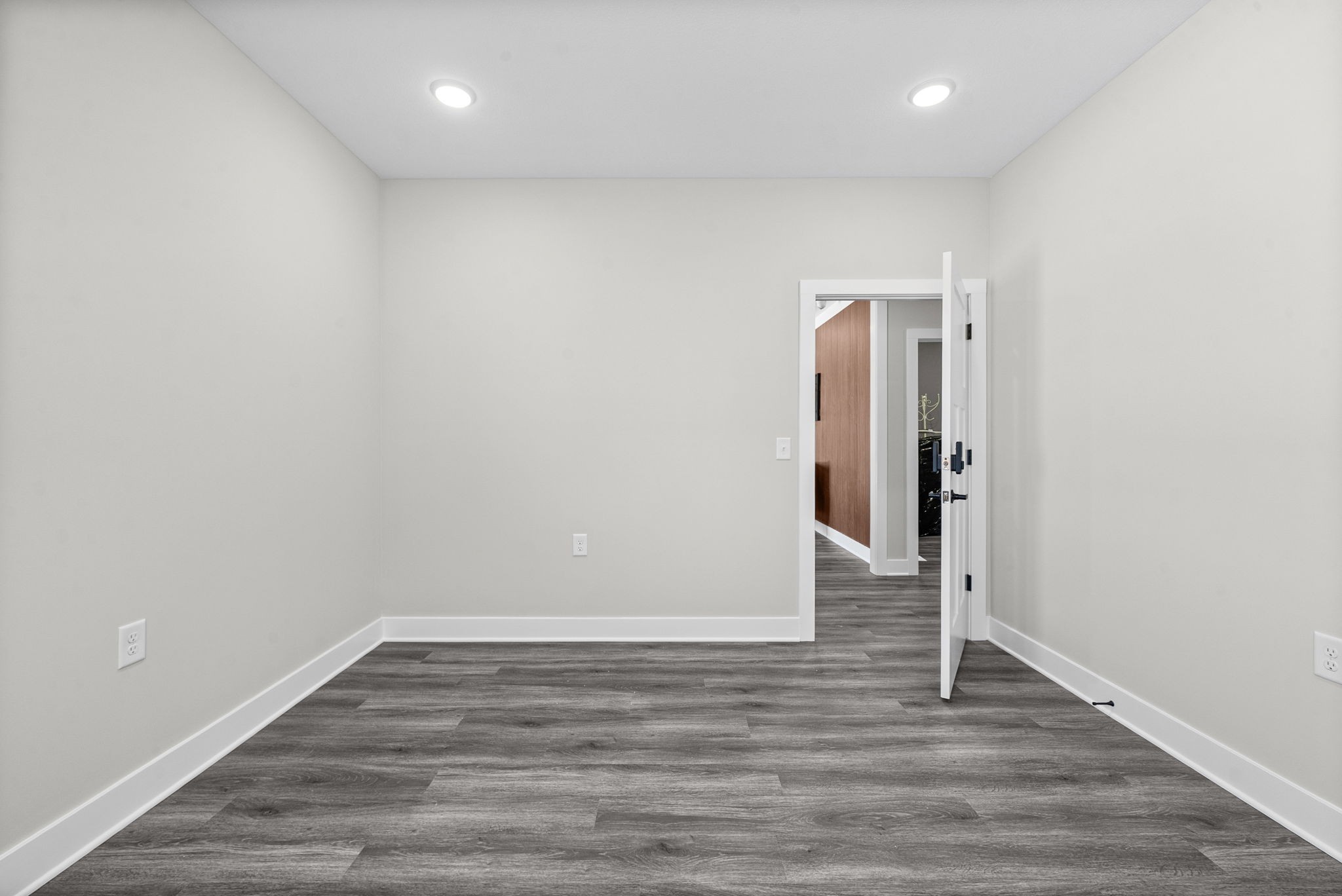 2510 Pea Ridge Road Clarksville, TN 37040 - Photo 33 of 40 an empty room with wooden floor and entrance