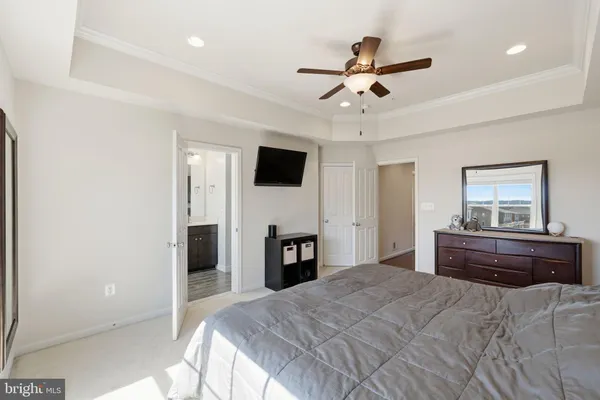 a bed room with a bed and a television