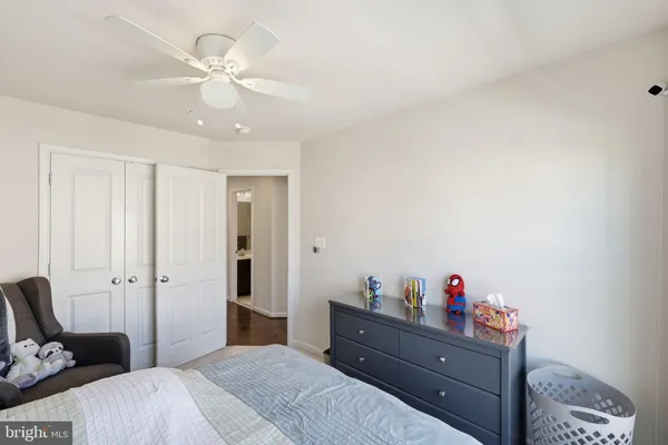 a bed room with a bed and a chandelier