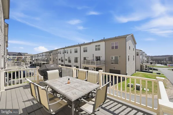 a view of a balcony with furniture