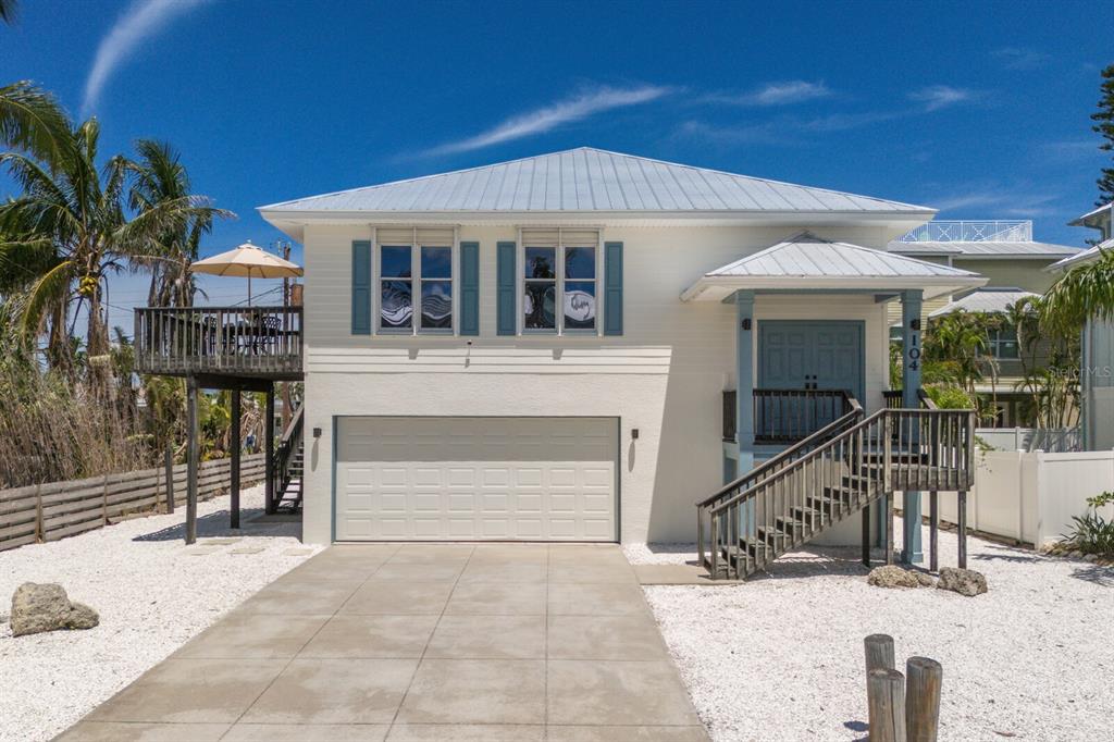 104 77th Street Holmes Beach, FL 34217 - Photo 1 of 1 a view of house with outdoor space