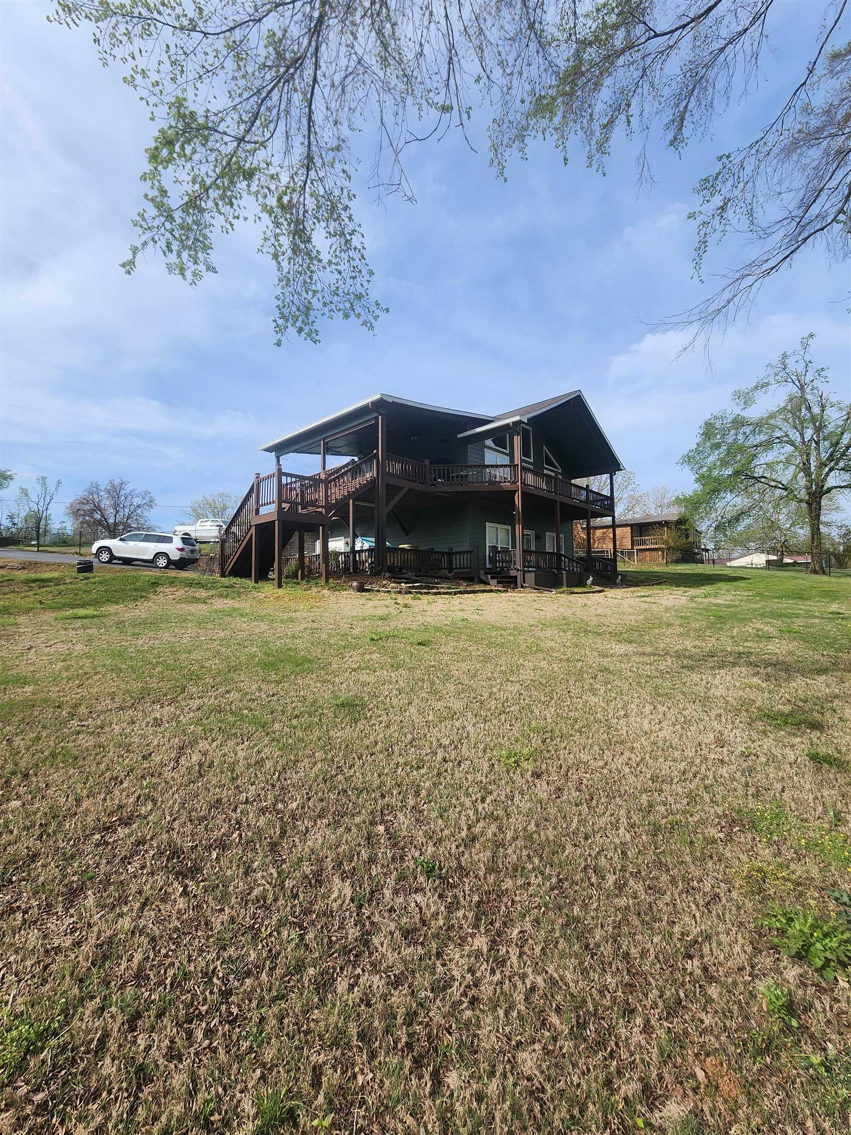 620 Old Road Counce, TN 38326 - Photo 11 of 32 Back of property with a deck and a yard