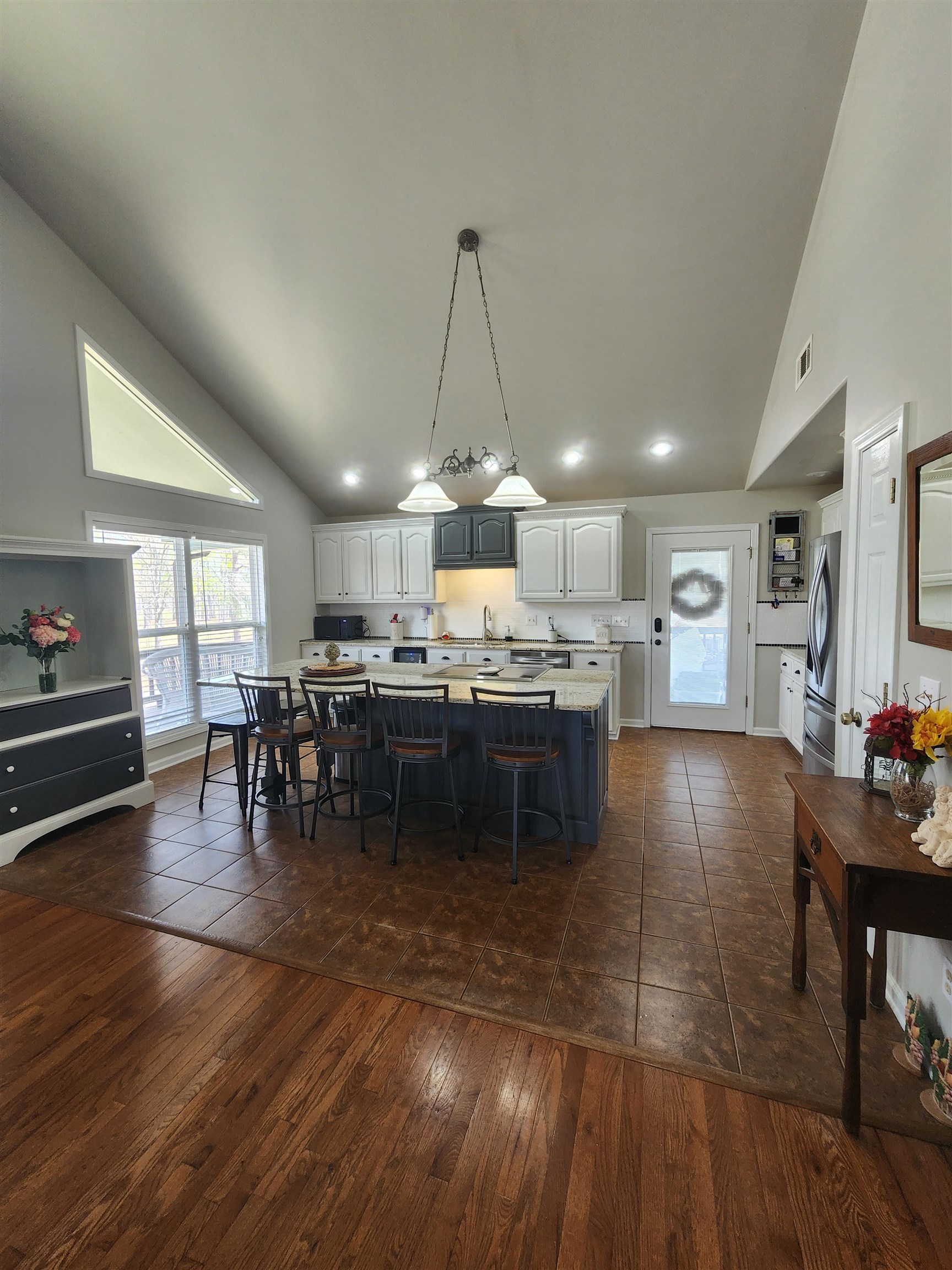 620 Old Road Counce, TN 38326 - Photo 13 of 32 a kitchen with lots of counter top space and dining table chairs