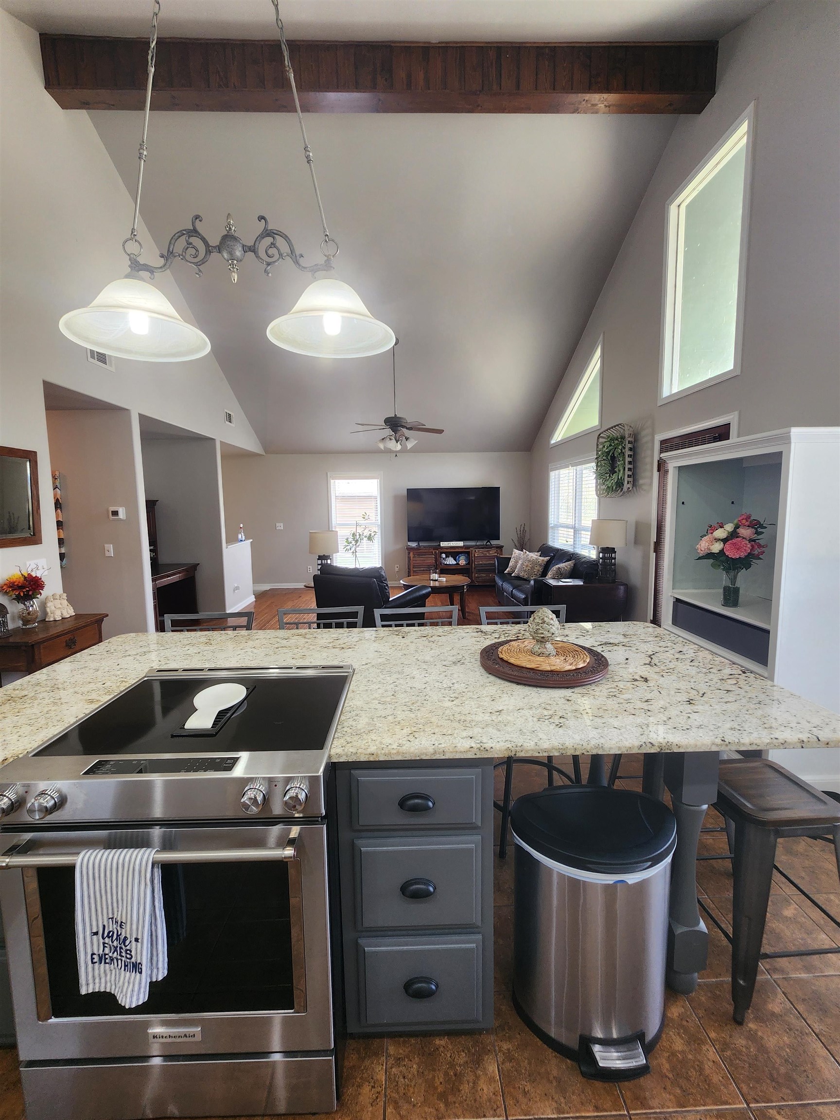 620 Old Road Counce, TN 38326 - Photo 32 of 32 a kitchen with stainless steel appliances granite countertop a sink a stove and a wooden cabinets