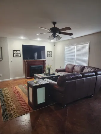 a room with furniture and wooden floor