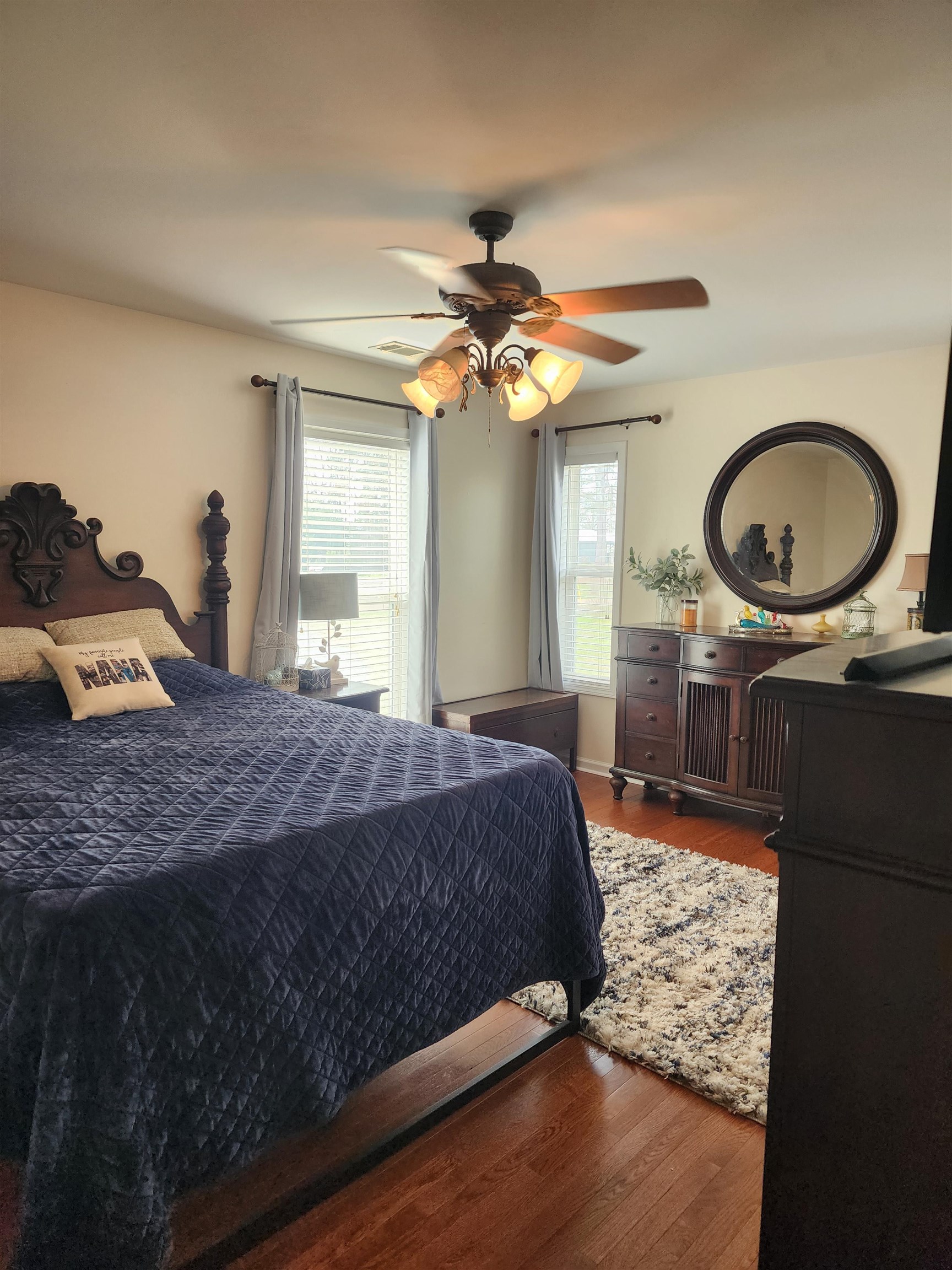 620 Old Road Counce, TN 38326 - Photo 19 of 32 a bedroom with a bed and a chandelier