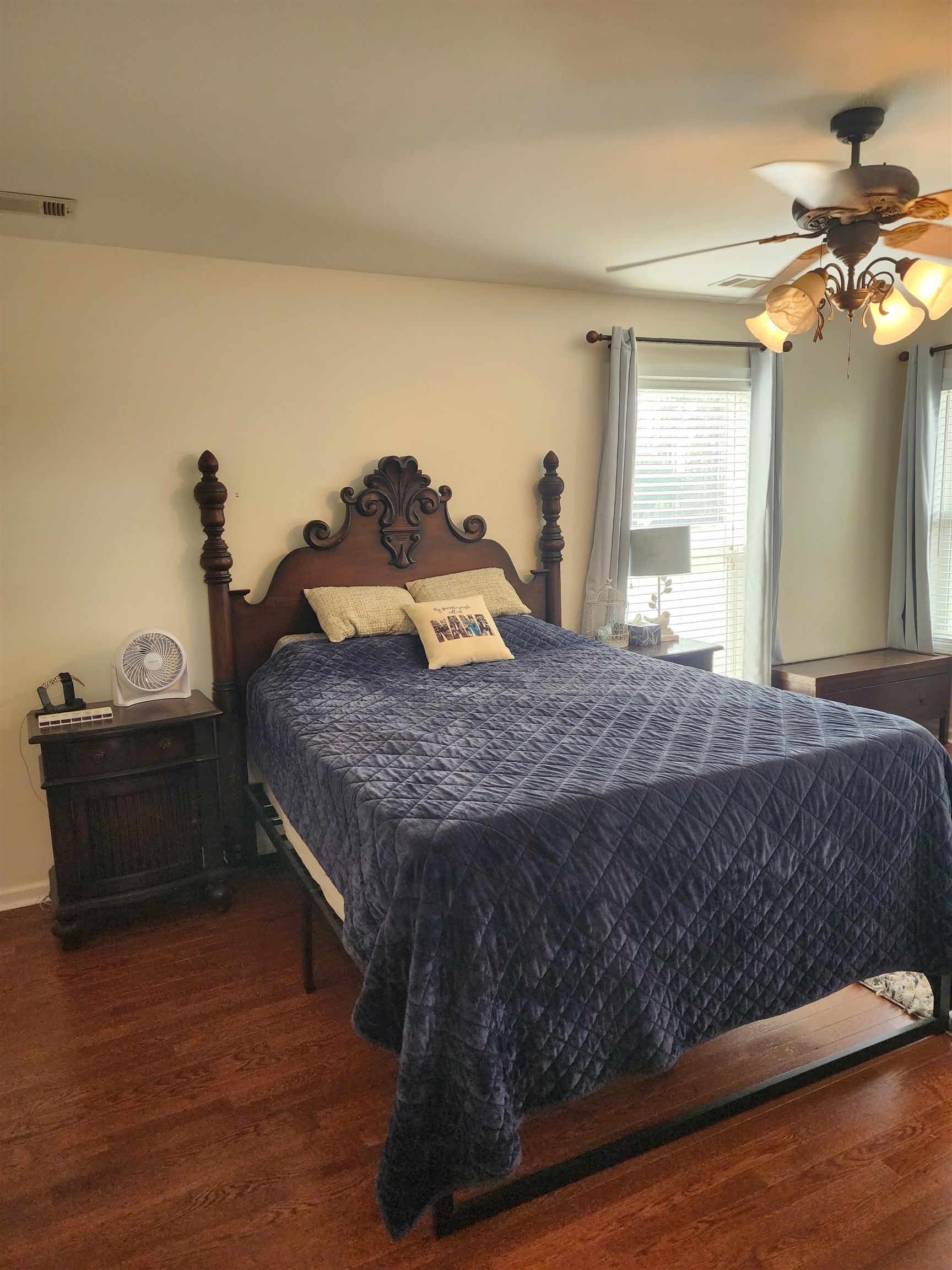 620 Old Road Counce, TN 38326 - Photo 20 of 32 a large bed sitting in a bedroom next to a window and a chandelier