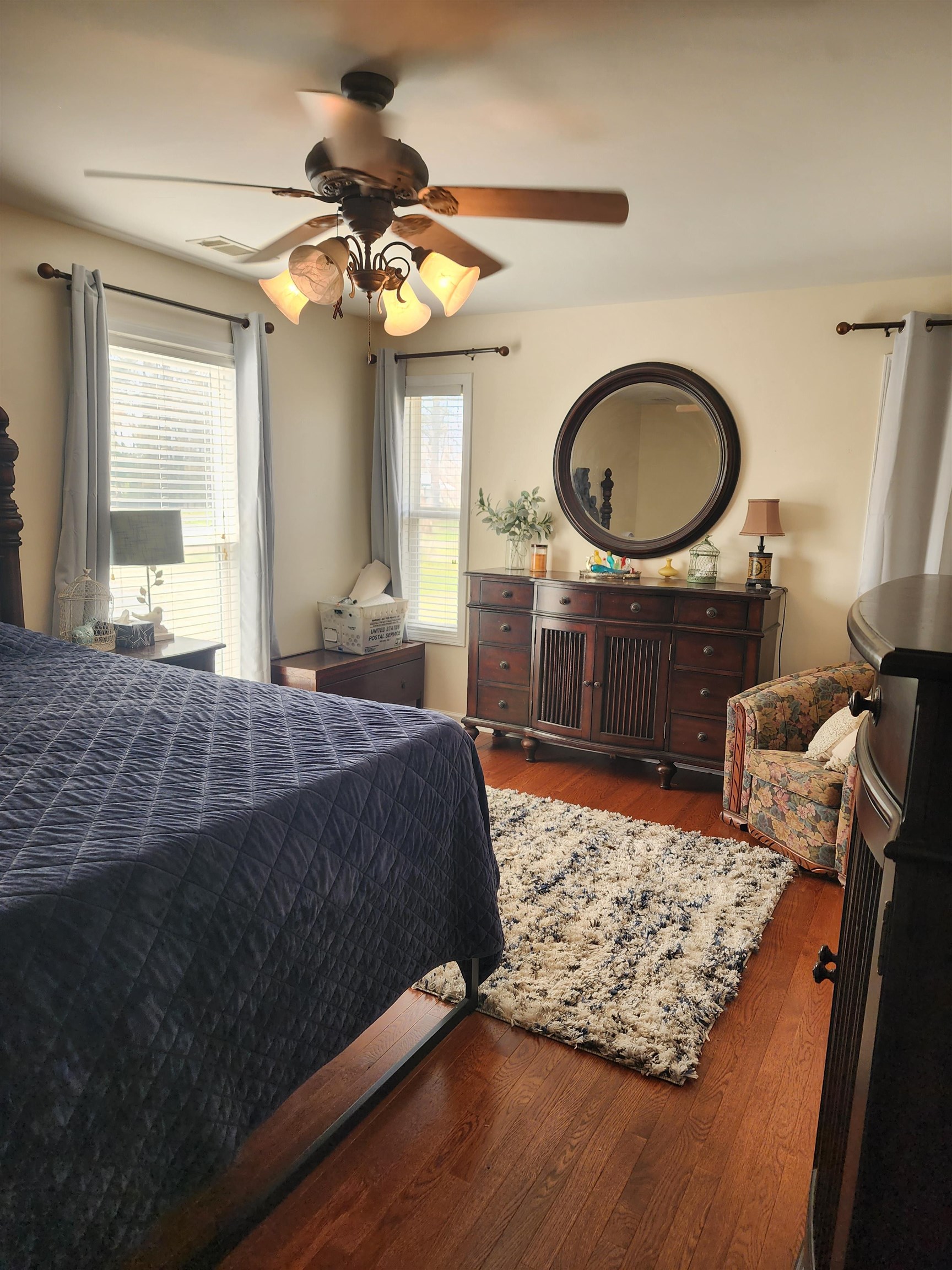 620 Old Road Counce, TN 38326 - Photo 21 of 32 a bedroom with a bed dresser and a chandelier