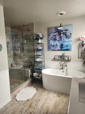 a bathroom with a sink a toilet and bathtub