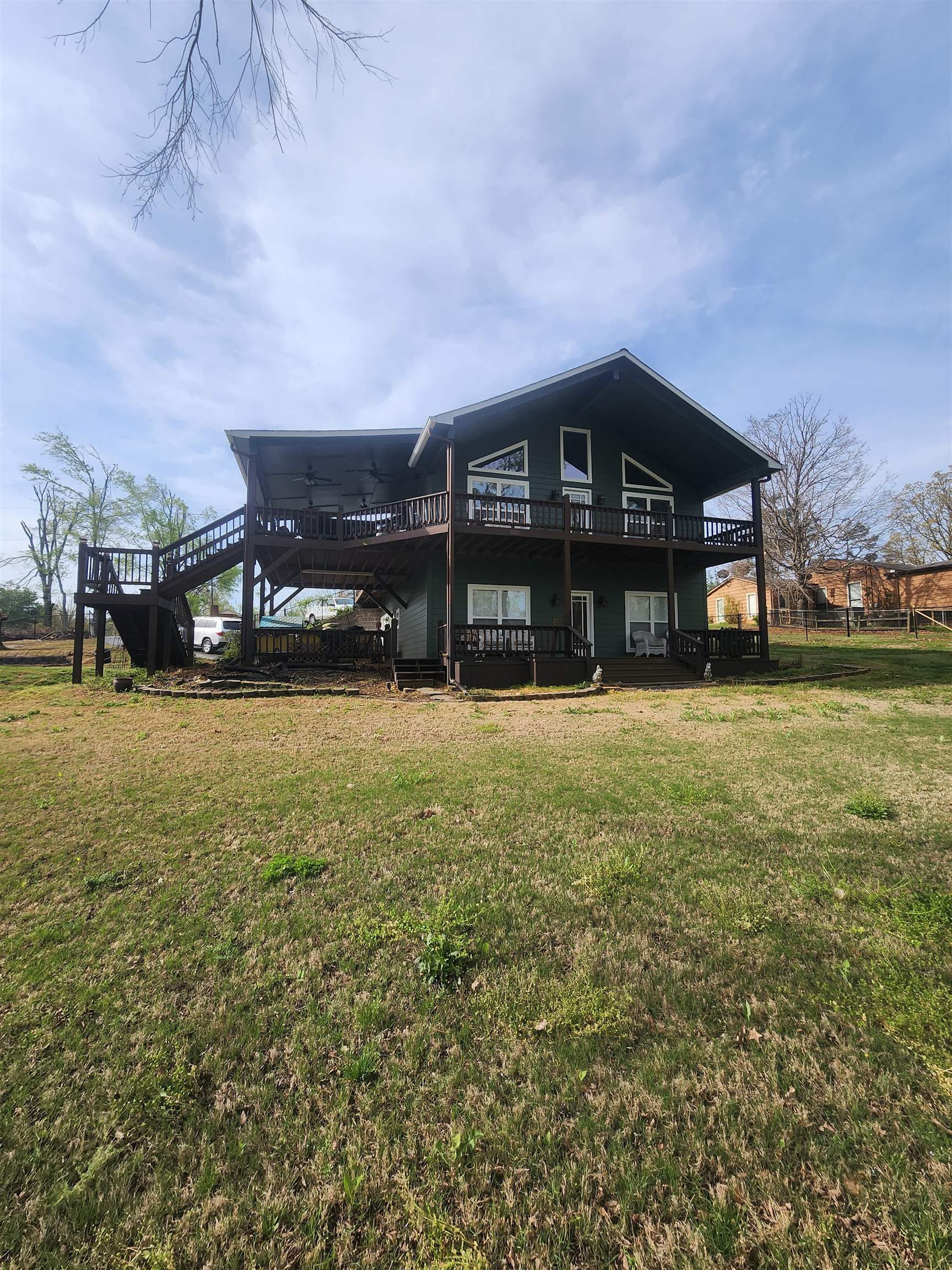 620 Old Road Counce, TN 38326 - Photo 9 of 32 a view of a big house with a big yard and large trees