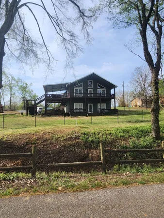 a kitchen with lots of counter top space and dining table chairs