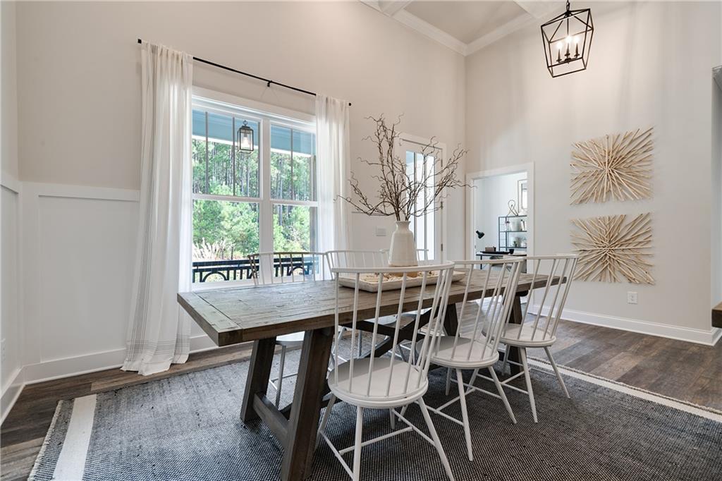 138 Torrey Pines Circle Villa Rica, GA 30180 - Photo 3 of 18 a view of a dining room with furniture and wooden floor