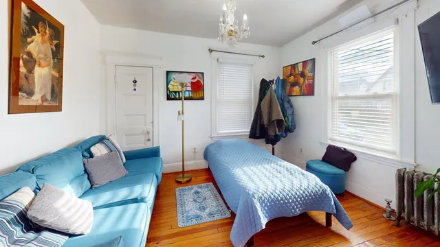 a living room with furniture rug and window