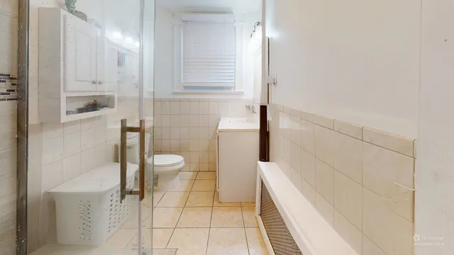 a bathroom with a shower and a toilet