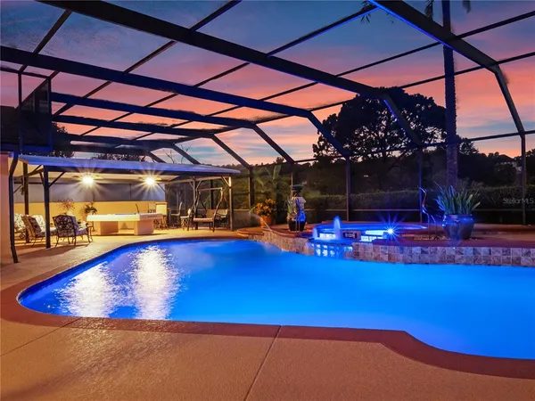 a view of swimming pool with outdoor seating