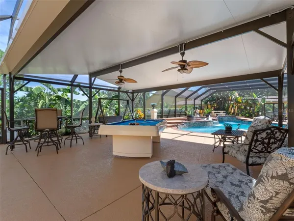 a dining room with furniture and a garden