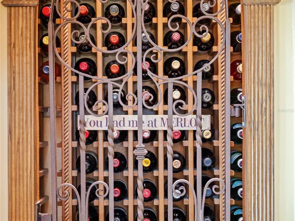 a bed room with a bed mirror and a table