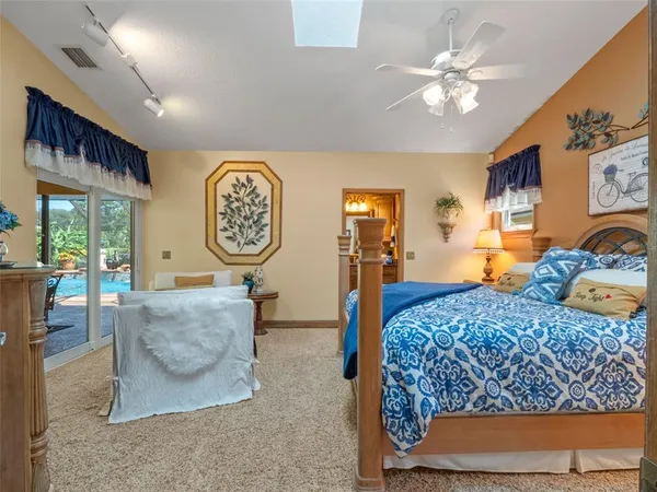 a bathroom with a sink vanity mirror and toilet