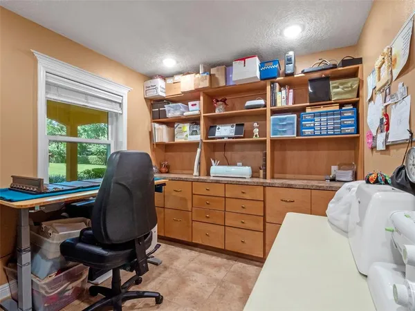 a view of house with outdoor space and swimming pool