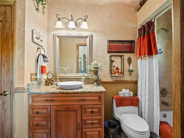 a view of a room with chairs and couch