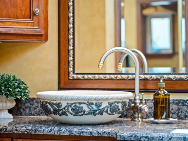 a view of a green yard with an outdoor seating