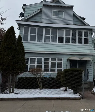 a front view of a house with garage