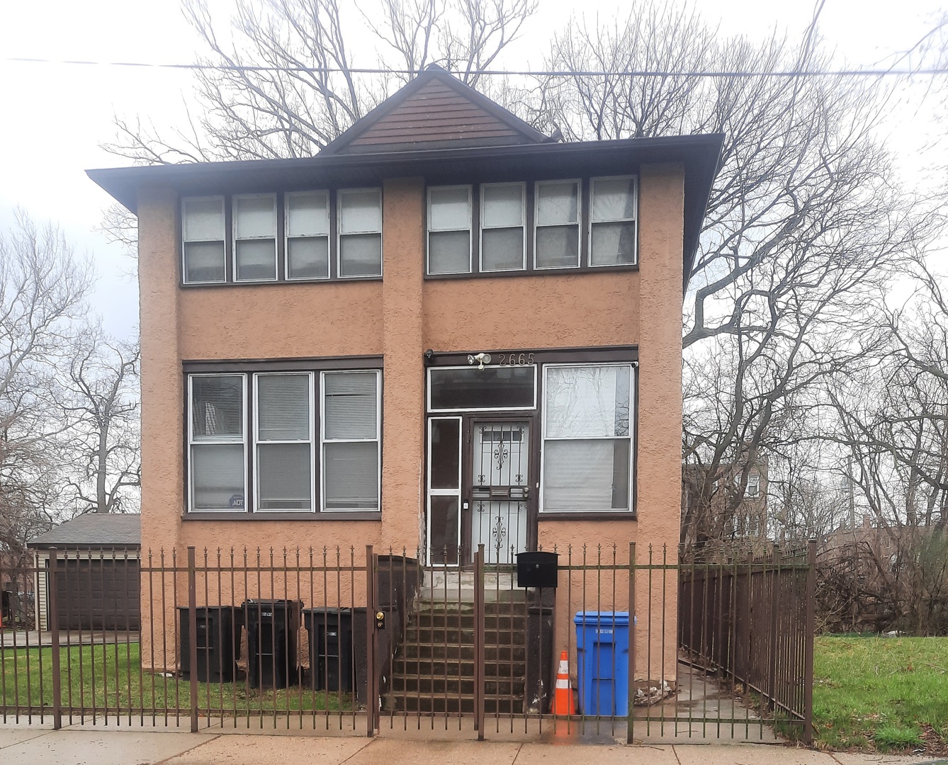 a front view of a house with glass windows