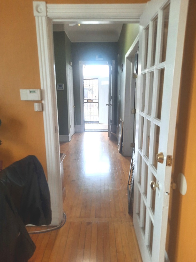 2665 East 77th Street Chicago, IL 60649 - Photo 15 of 46 a view of entryway with furniture and wooden floor