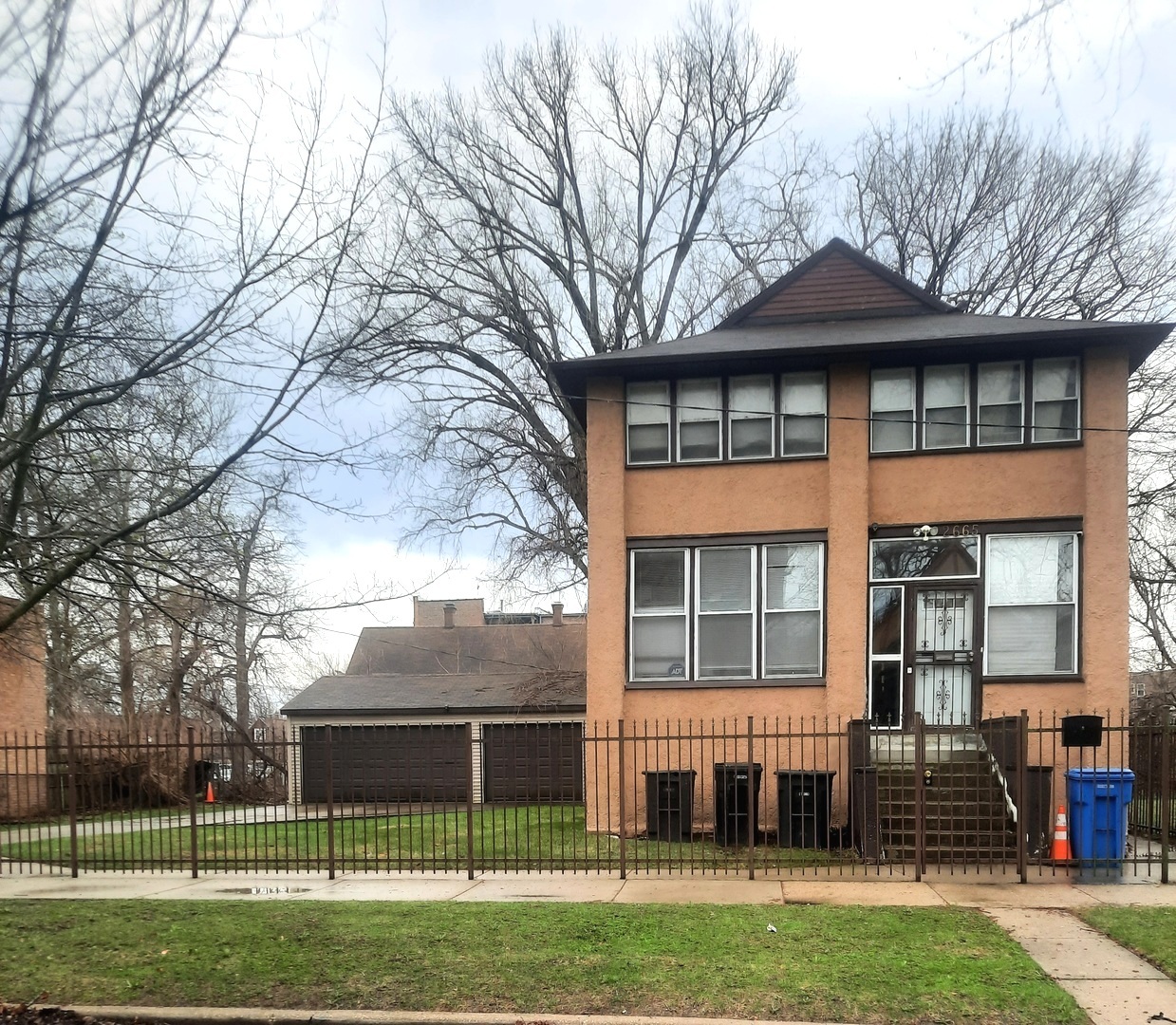 2665 East 77th Street Chicago, IL 60649 - Photo 2 of 46 a front view of a house with a yard