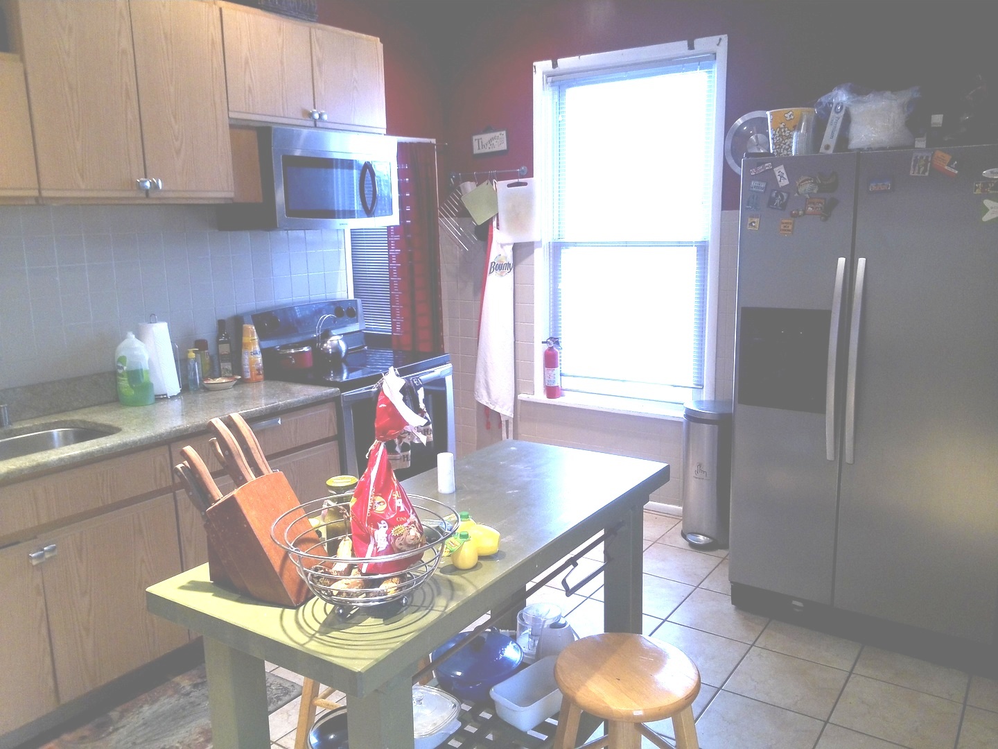 2665 East 77th Street Chicago, IL 60649 - Photo 26 of 46 a kitchen with stainless steel appliances granite countertop a sink refrigerator and microwave