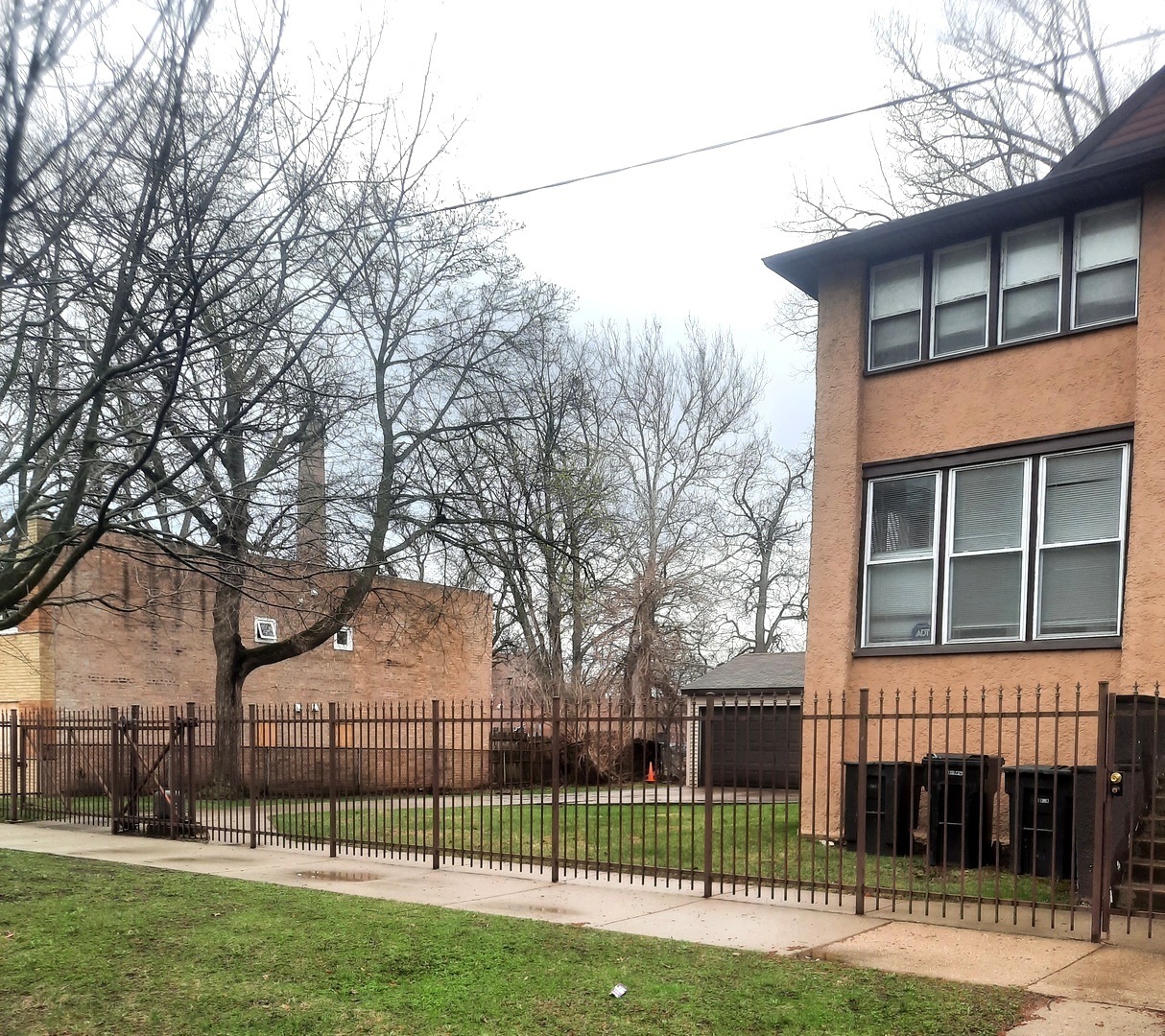 2665 East 77th Street Chicago, IL 60649 - Photo 3 of 46 a view of a backyard that has a tree