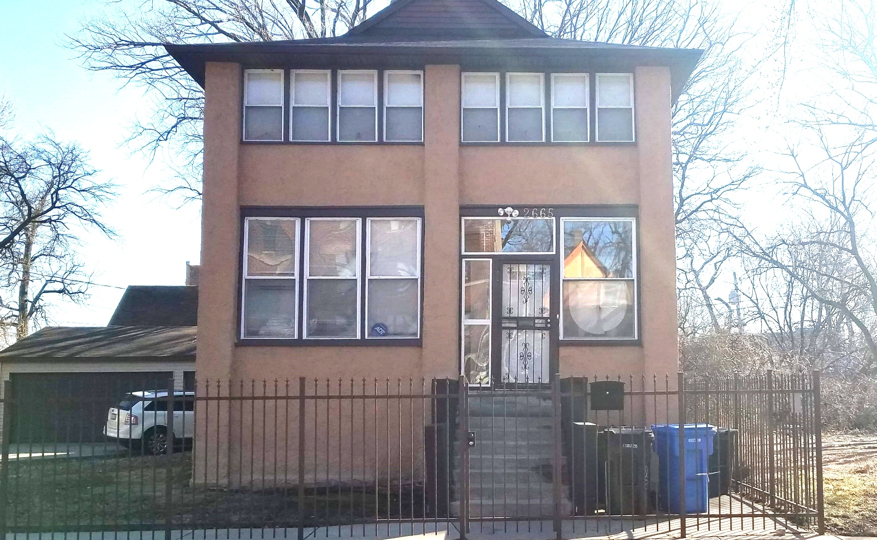 2665 East 77th Street Chicago, IL 60649 - Photo 36 of 46 a front view of a house with a glass door