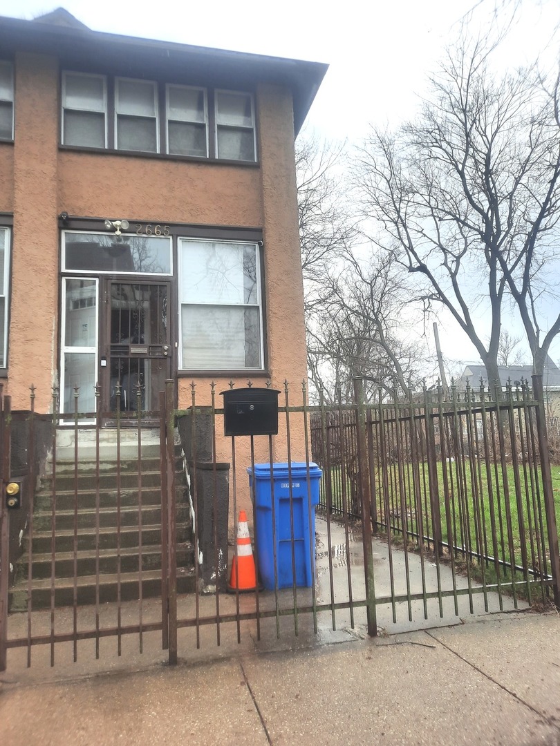 2665 East 77th Street Chicago, IL 60649 - Photo 38 of 46 a view of a house with iron fence