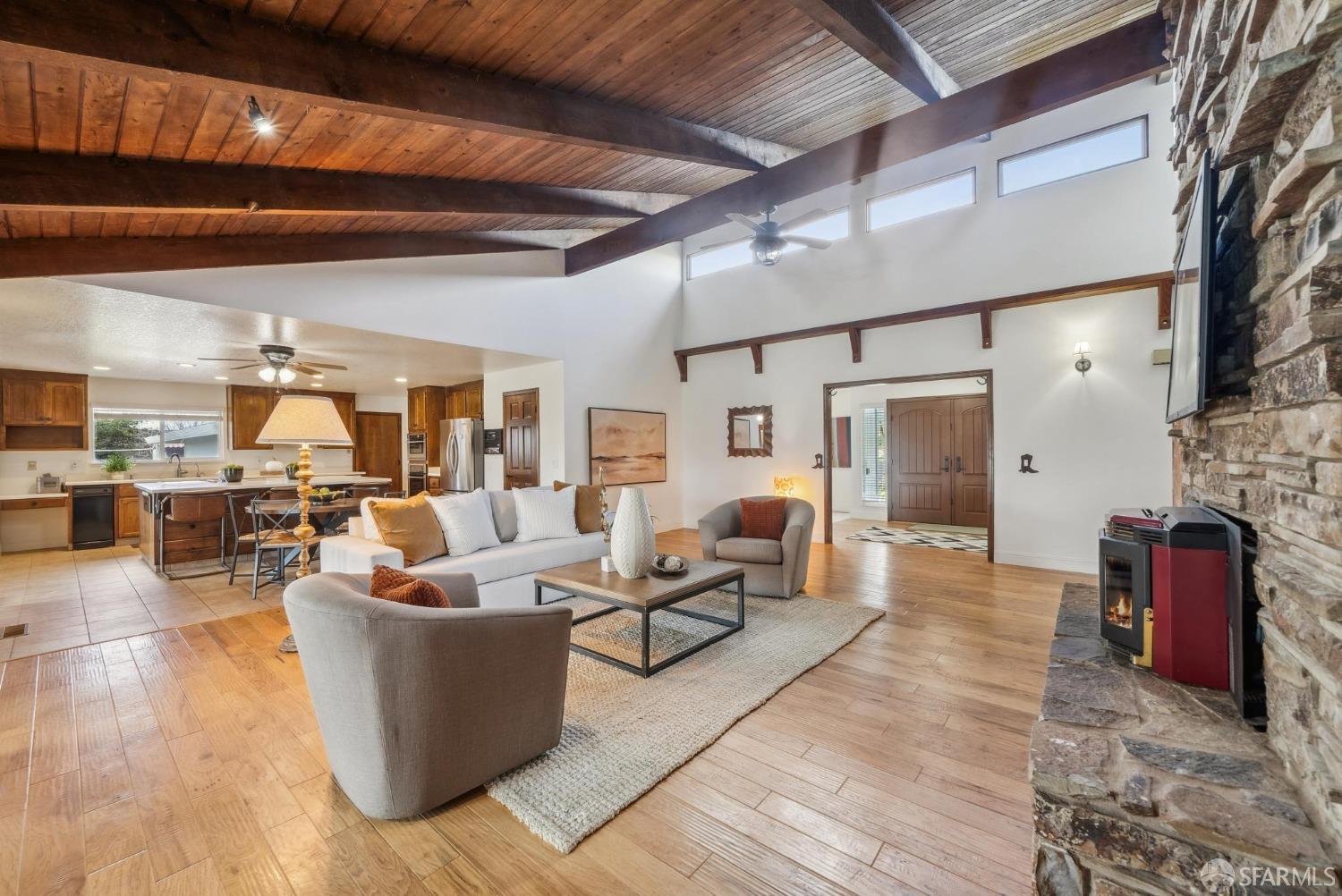 4355 Raymond Road Livermore, CA 94551 - Photo 19 of 74 a living room with fireplace furniture and a chandelier