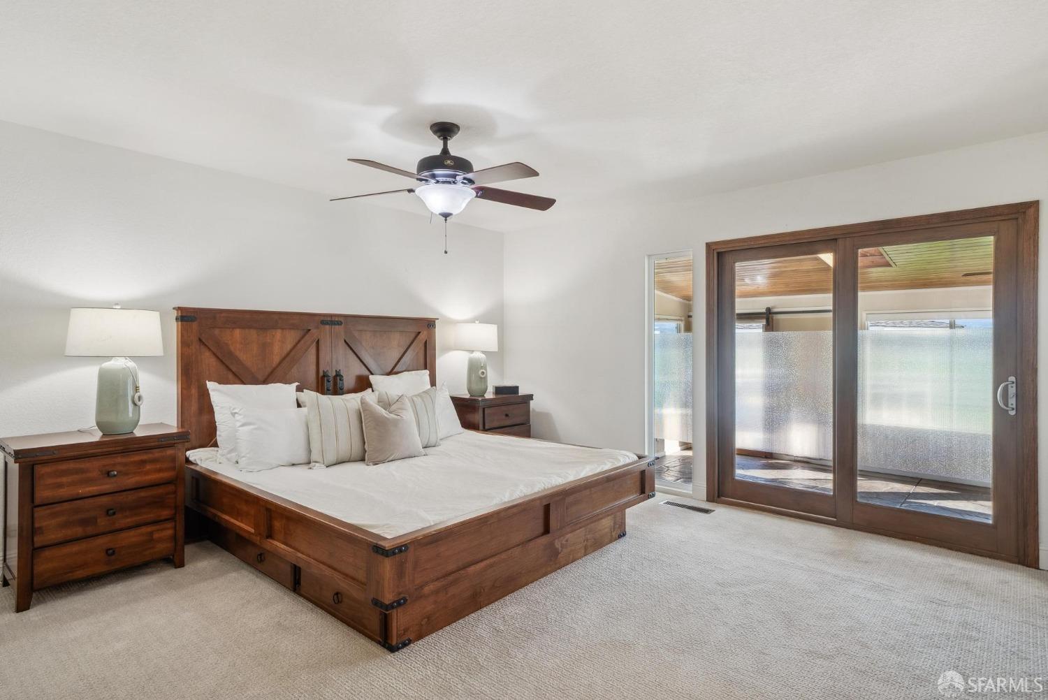 4355 Raymond Road Livermore, CA 94551 - Photo 26 of 74 a bedroom with a bed lamp and a large window