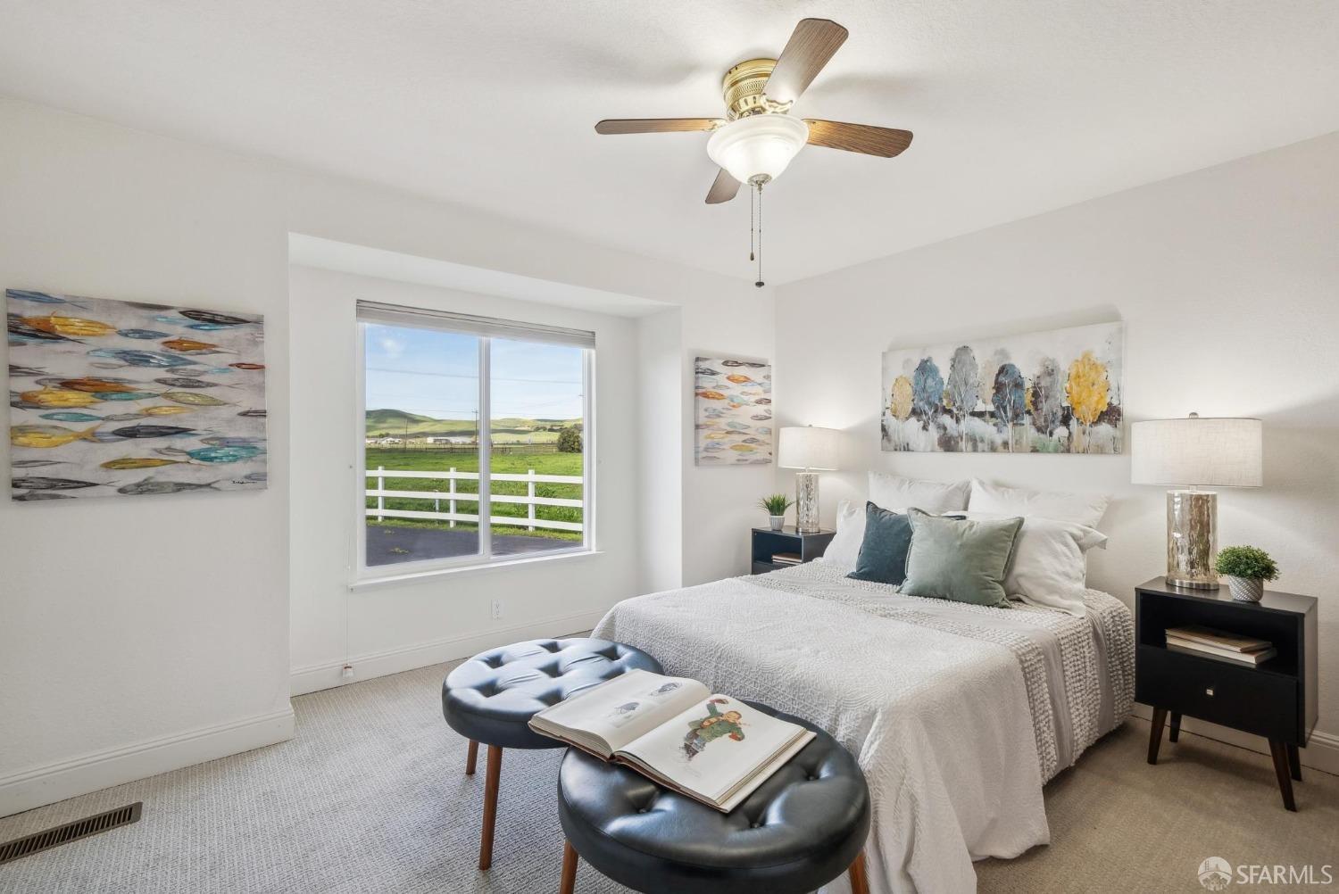 4355 Raymond Road Livermore, CA 94551 - Photo 35 of 74 a bedroom with a bed a chandelier and a window