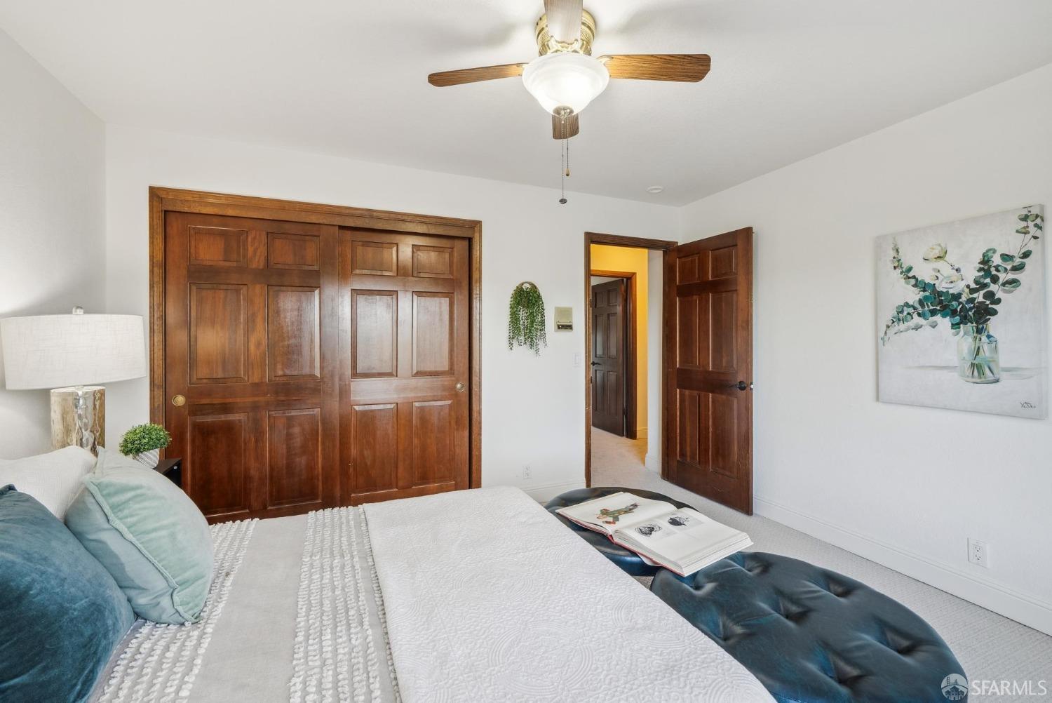 4355 Raymond Road Livermore, CA 94551 - Photo 36 of 74 a bedroom with a bed and a chandelier