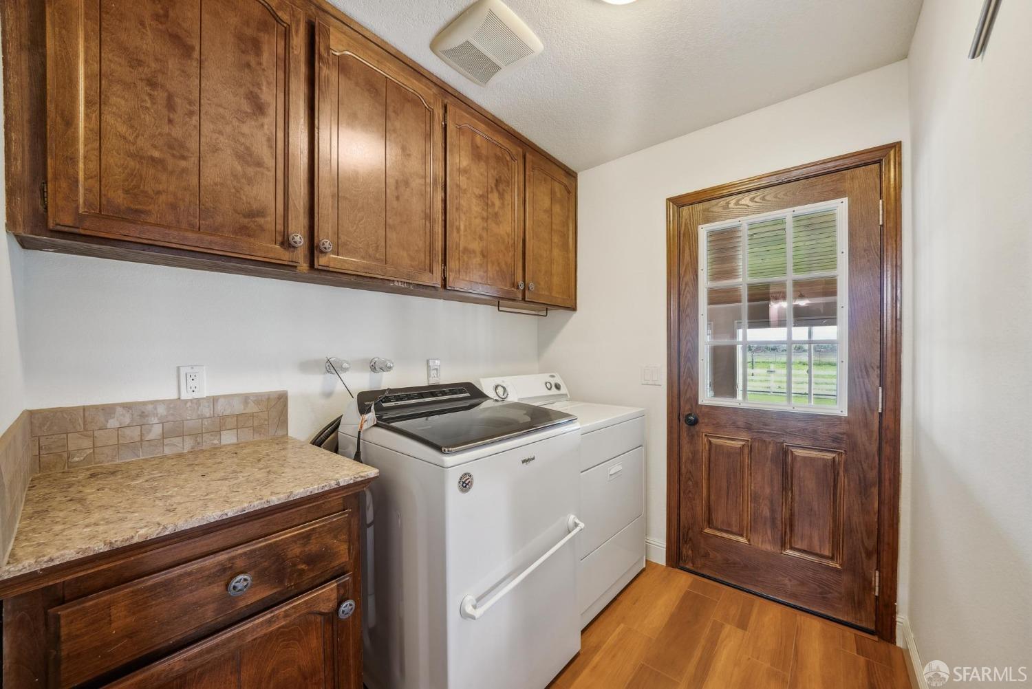4355 Raymond Road Livermore, CA 94551 - Photo 42 of 74 a view of a storage and utility room with washer and dryer