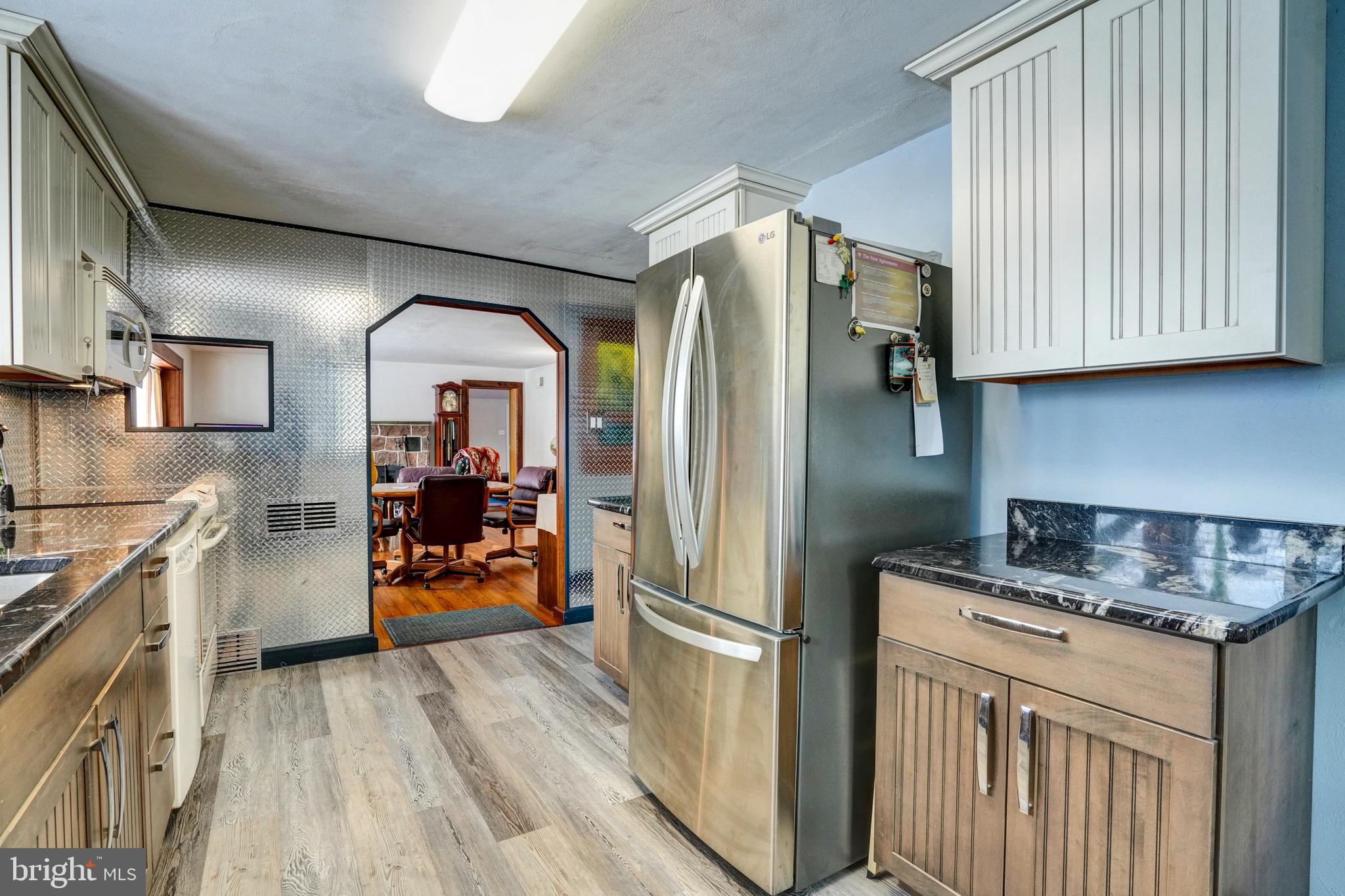 1211 Old Schuylkill Road Pottstown, PA 19465 - Photo 16 of 54 a kitchen with stainless steel appliances granite countertop a refrigerator and a sink