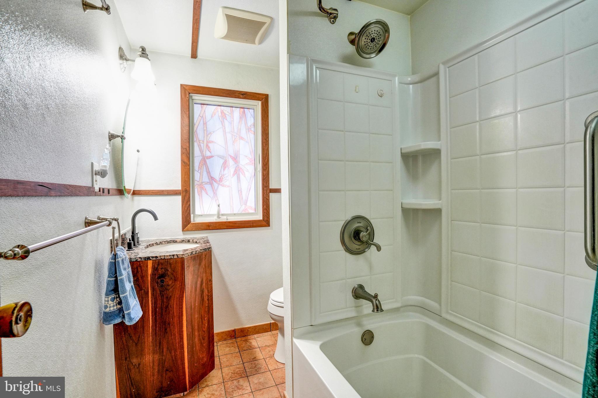 1211 Old Schuylkill Road Pottstown, PA 19465 - Photo 20 of 54 a bathroom with a tub sink and mirror