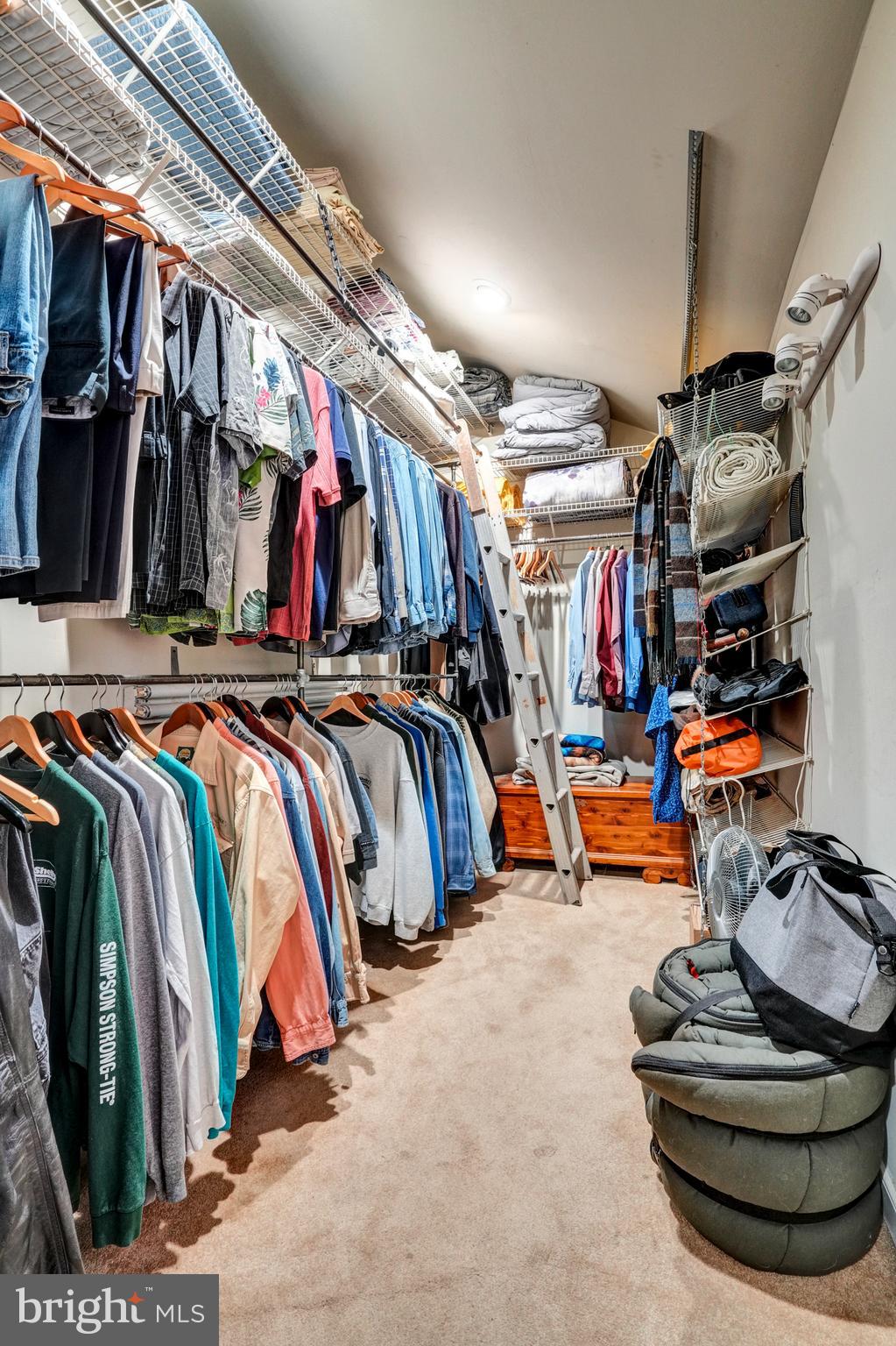 1211 Old Schuylkill Road Pottstown, PA 19465 - Photo 26 of 54 a view of walk in closet with clothes and shoes