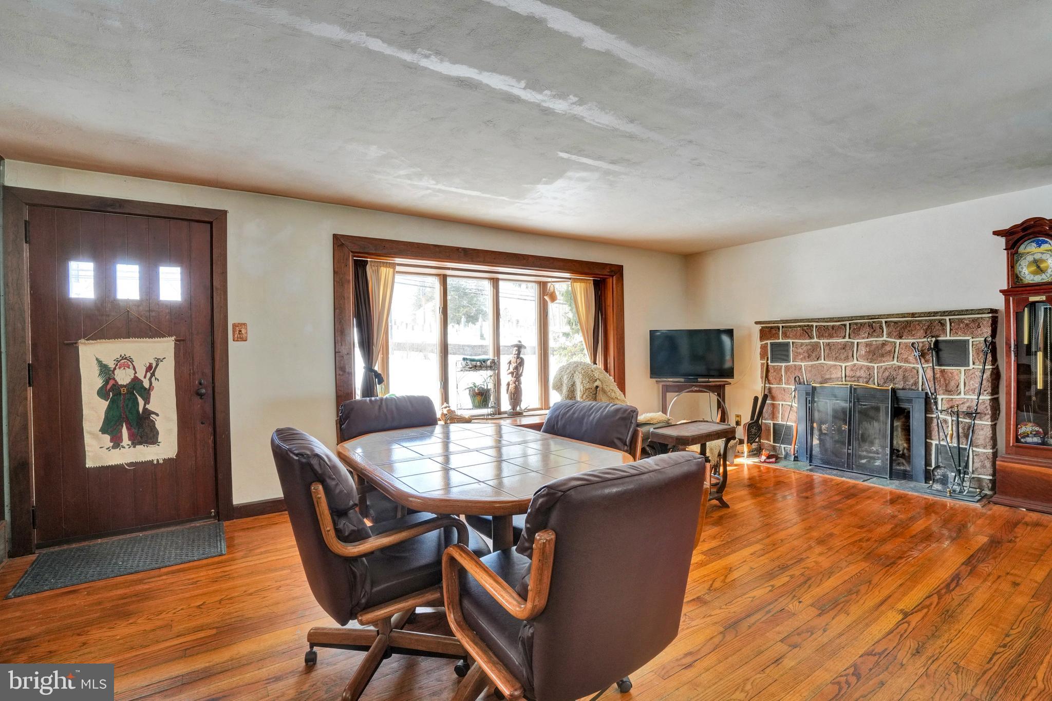 1211 Old Schuylkill Road Pottstown, PA 19465 - Photo 29 of 54 a living room with dining room and wooden floor