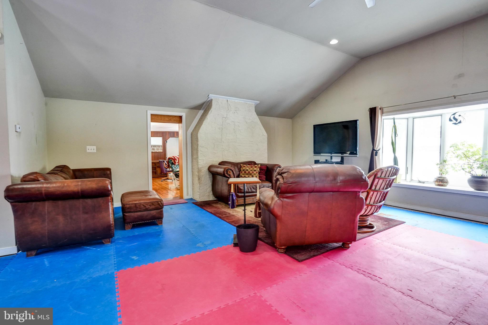 1211 Old Schuylkill Road Pottstown, PA 19465 - Photo 34 of 54 a living room with furniture and a wooden floor