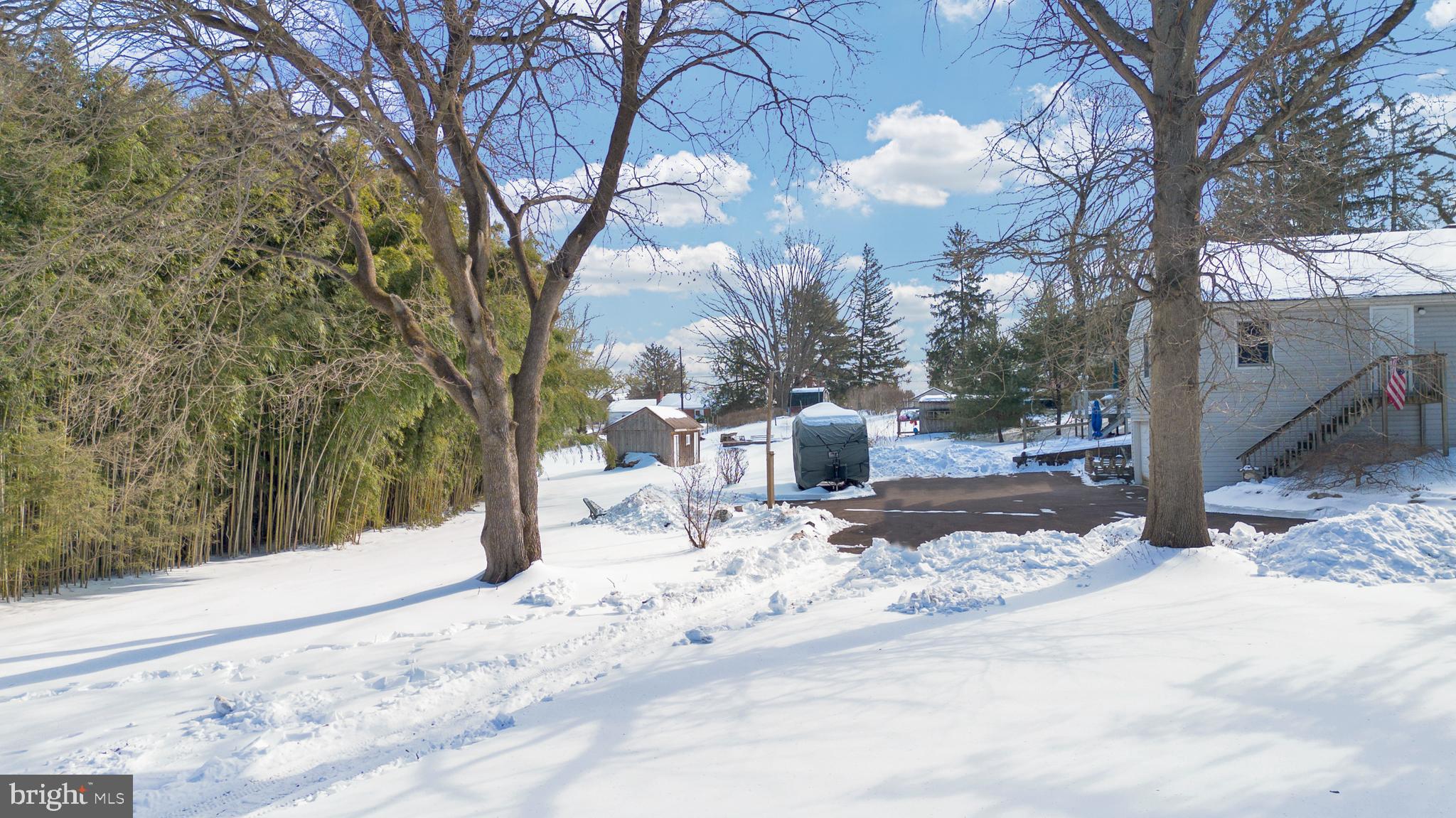 1211 Old Schuylkill Road Pottstown, PA 19465 - Photo 51 of 54 a view of a outdoor space covered with snow in the background