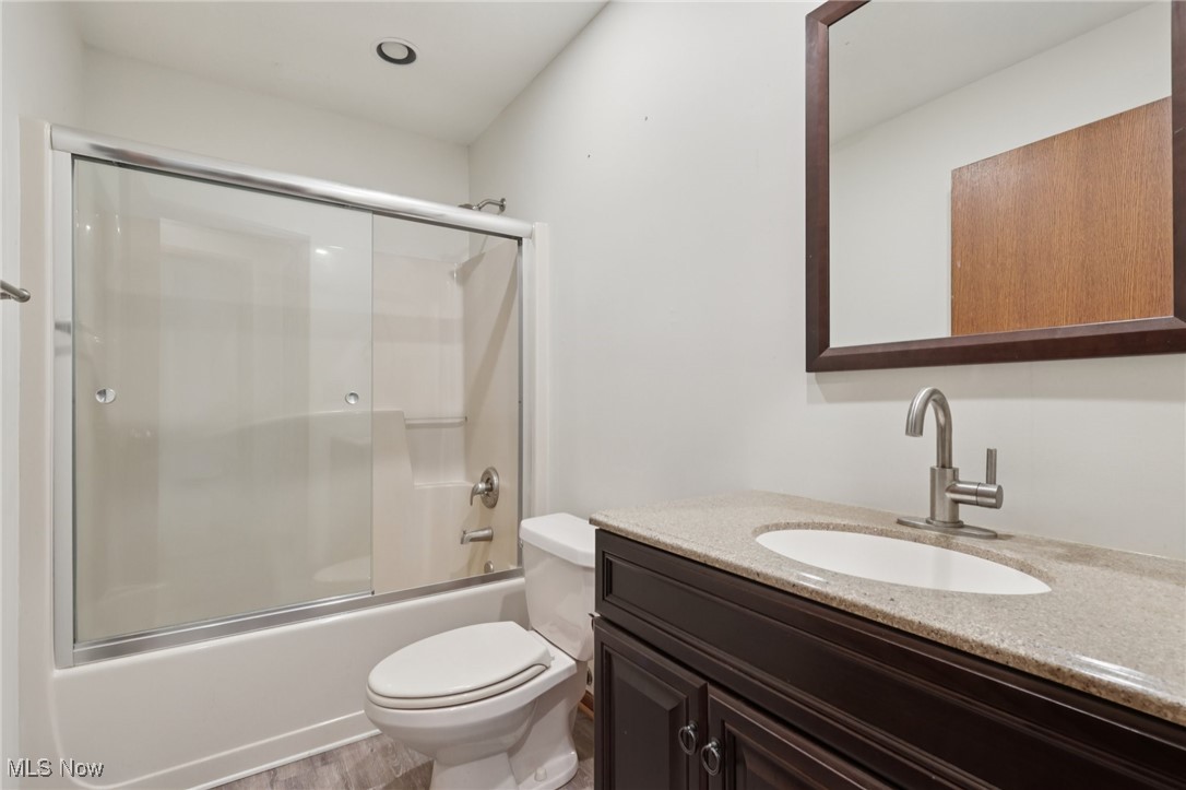 5643 Chapin Road Madison, OH 44057 - Photo 18 of 50 Full bath with vanity and combined bath / shower with glass door