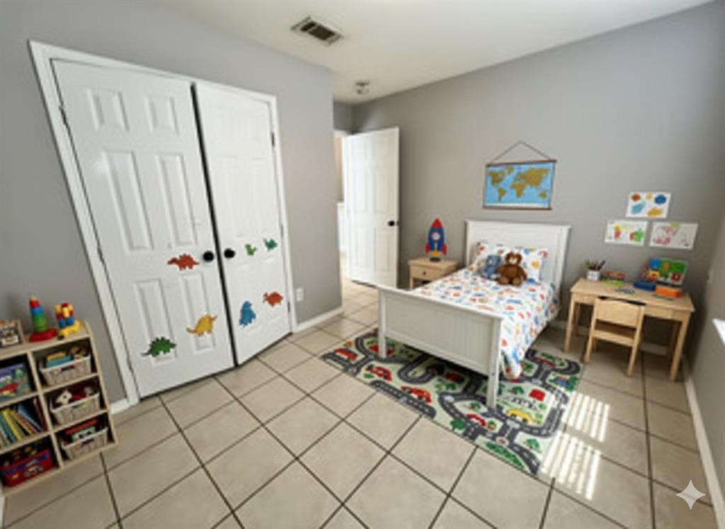 1707 Tina Marie Road, Unit A Arlington, TX 76012 - Photo 12 of 34 Bedroom 3 featuring double door closet -virtual staging