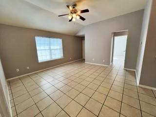 1707 Tina Marie Road, Unit A Arlington, TX 76012 - Photo 31 of 34 Living area(different angle) with a ceiling fan and high ceilings