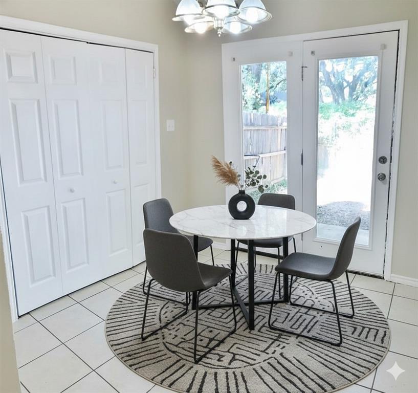 1707 Tina Marie Road, Unit A Arlington, TX 76012 - Photo 4 of 34 Dining room with laundry space behind double doors -virtual staging