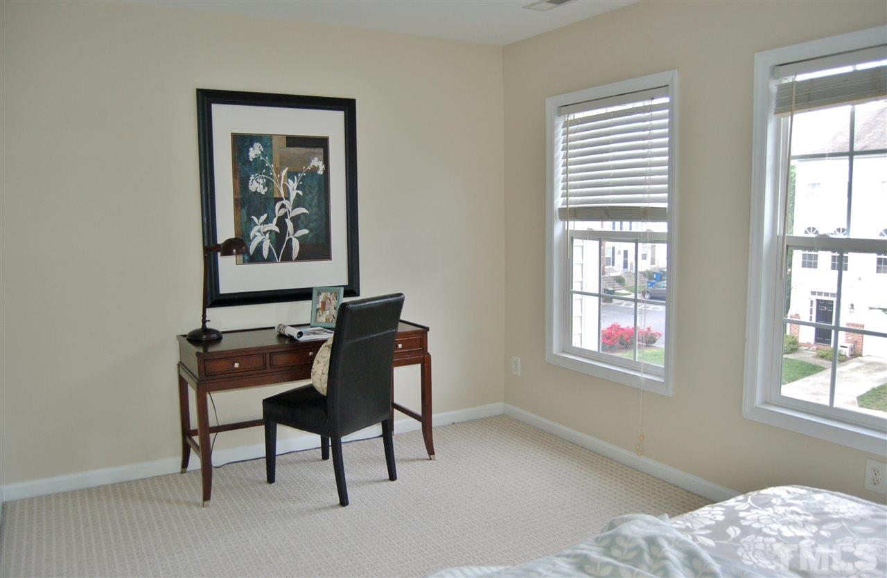 4713 Longhill Lane Raleigh, NC 27612 - Photo 11 of 18 a view of a workspace with furniture and a window