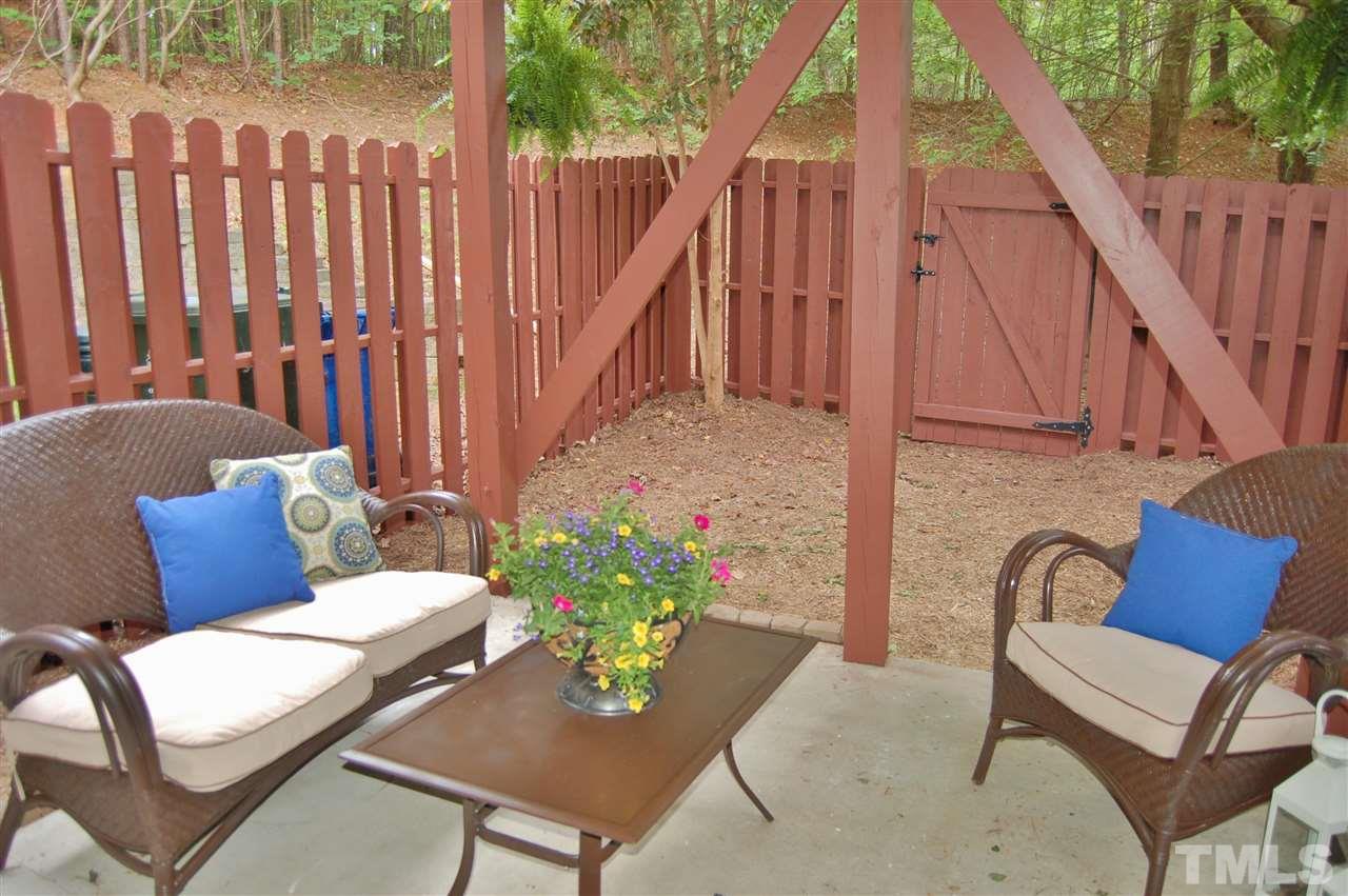 4713 Longhill Lane Raleigh, NC 27612 - Photo 16 of 18 a view of a chairs in patio with potted plants